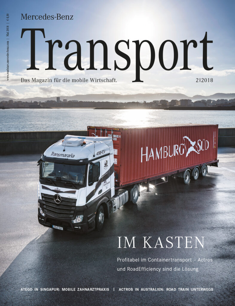 LKW im Hamburger Hafen bei Sonnenaufgang. Titelcover des Transport Magazin von Mercedes Benz Ausgabe 2 in 2018